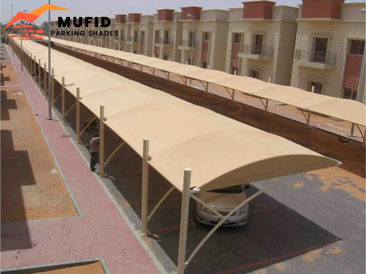 Mufid parking shades tensile structure over luxury cars showing modern sail design